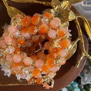 Orange and Gold Beaded Bracelet With Tulip & Butterfly Chamrs